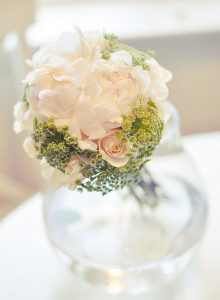 Delicate wedding center piece with blush flowers